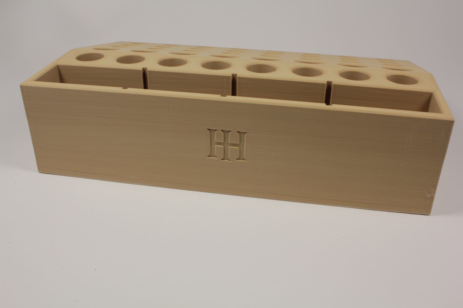 Rear view of Hideout Craft modular leather tool holder in kraft finish with embossed HH logo