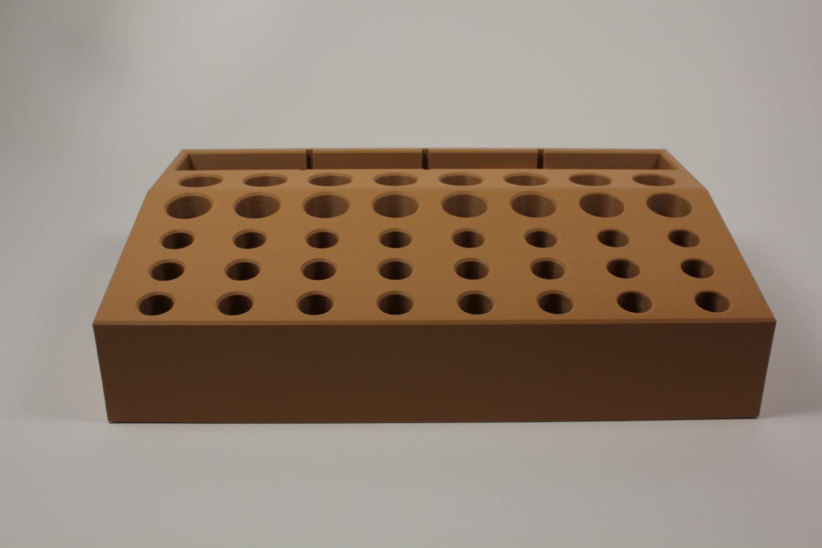 Front view of Hideout Craft modular leather tool holder in wood finish