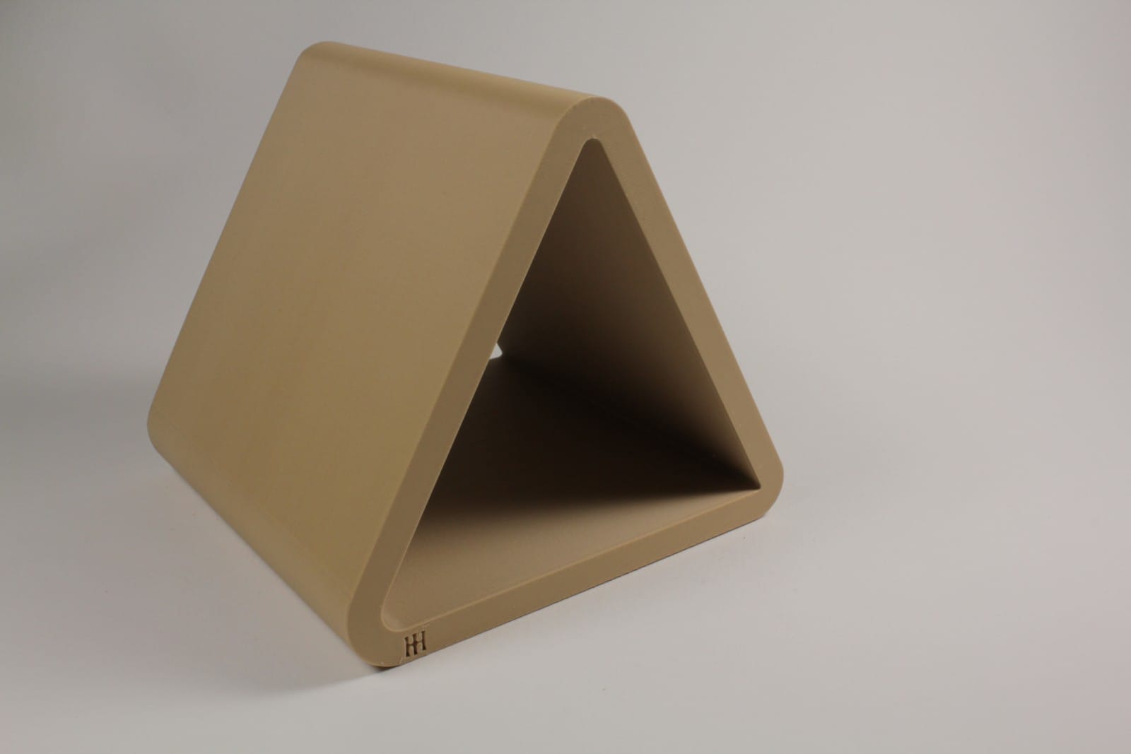 Hideout strap bending jig in kraft finish used for controlled leather strap bending