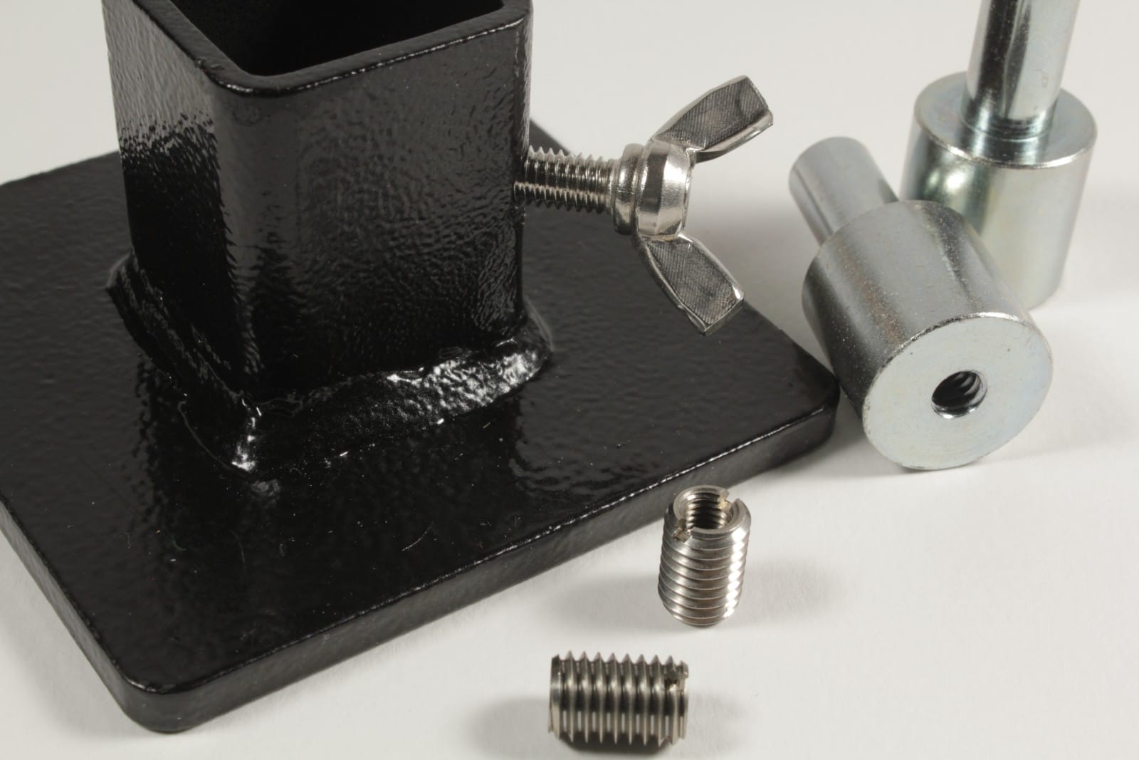 Close-up of zinc-plated arbor press ram adapters and M8 to M5 reducer inserts