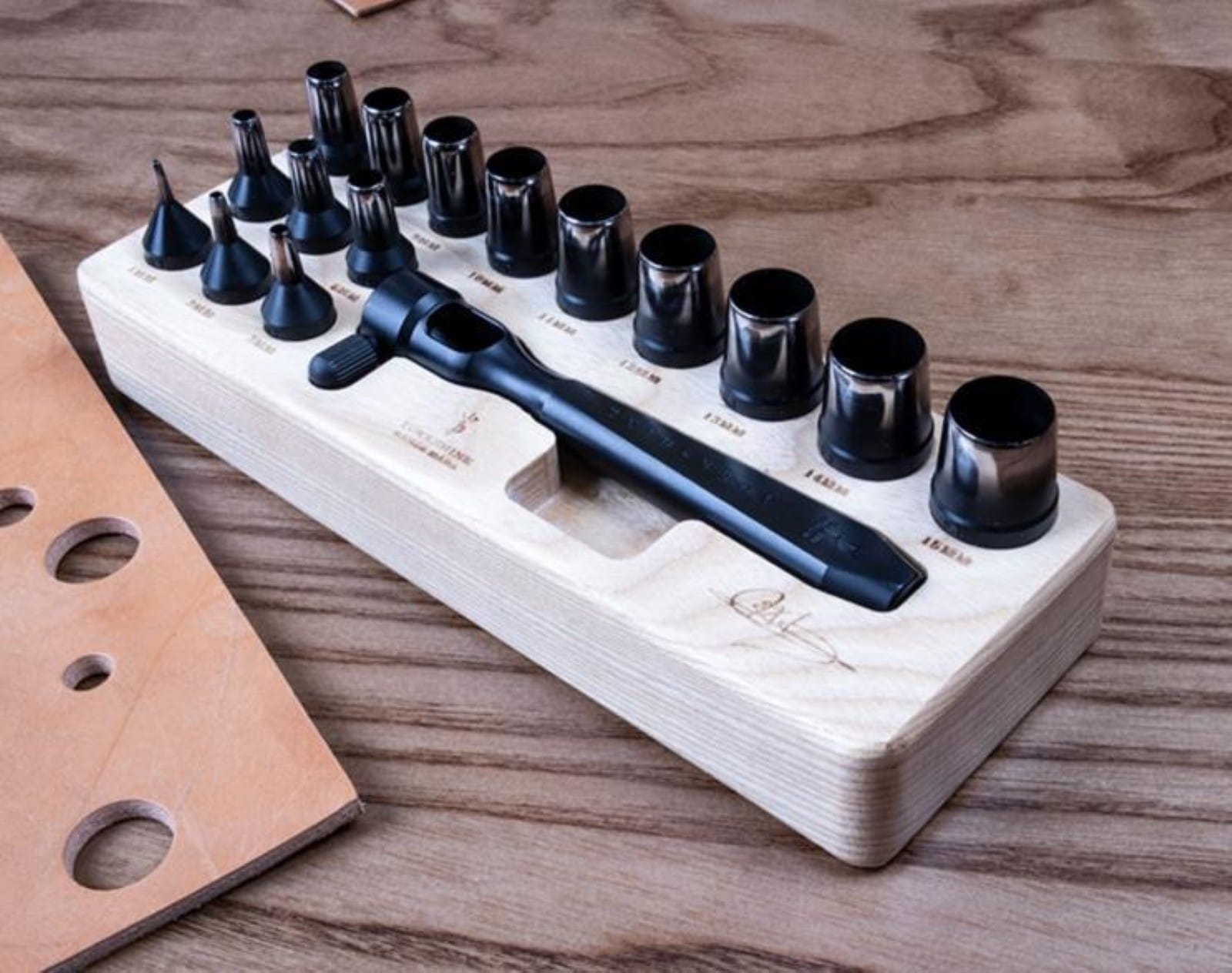 Leather punch set stored in organiser block