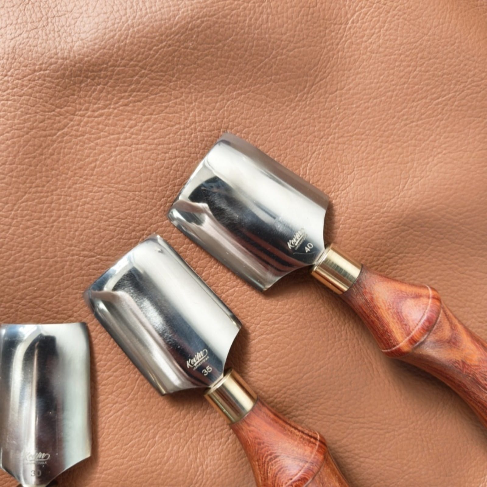 Close-up of leather corner knife punch tool