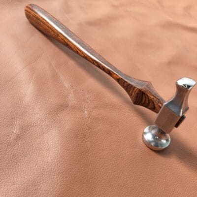 Leatherworking hammer on workbench