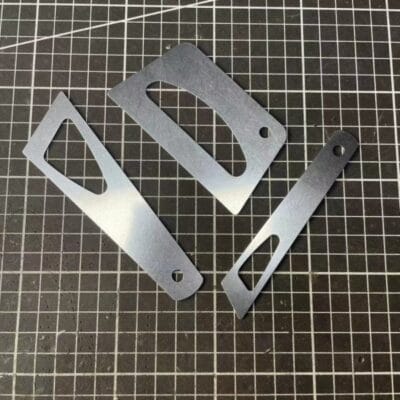 Flat metal glue spreader for leatherwork