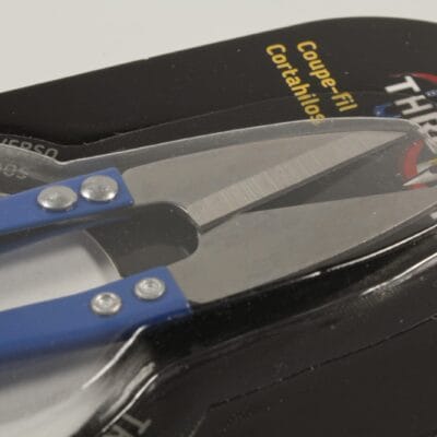 Close up of sharp pointed blades on spring loaded thread snips