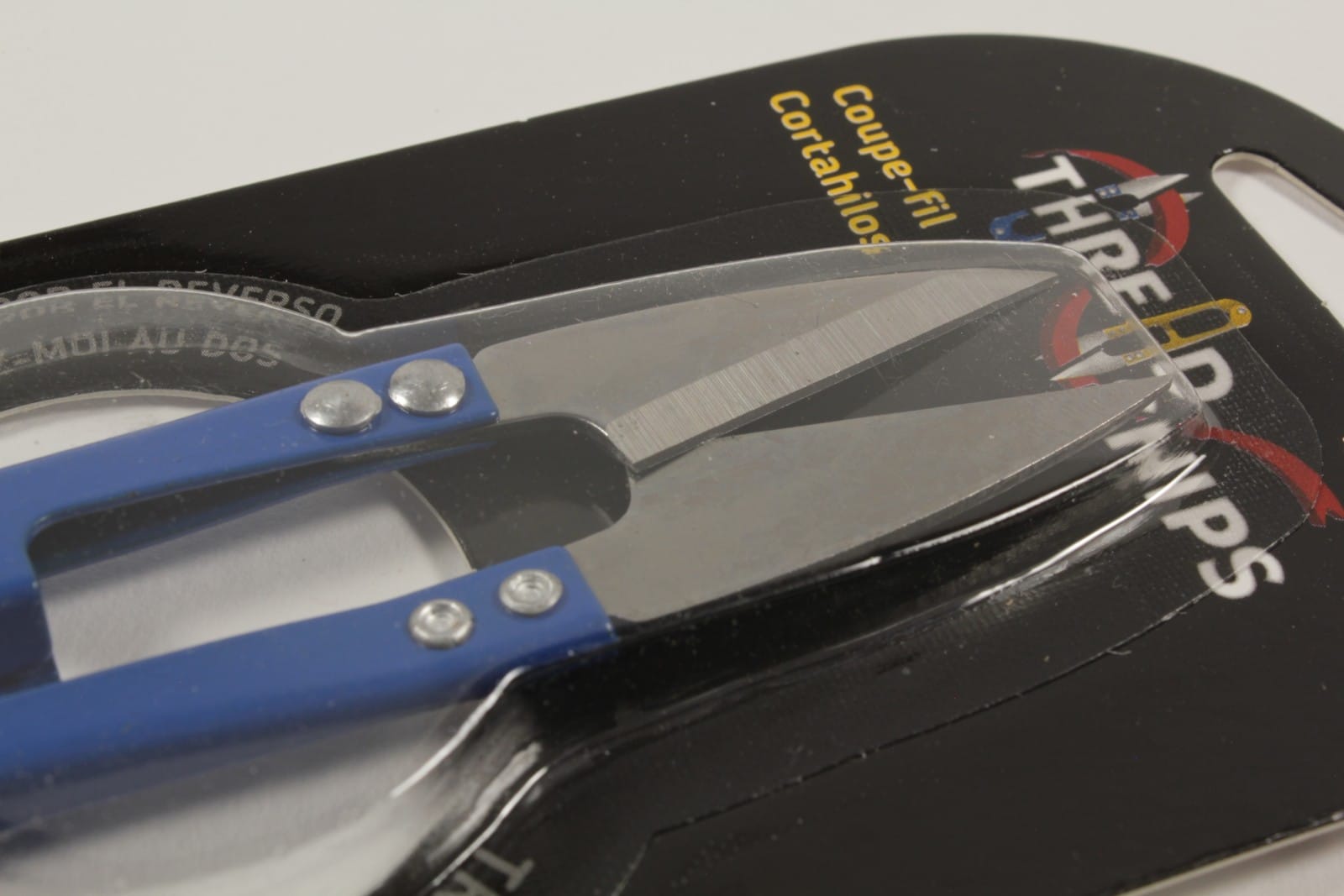 Close up of sharp pointed blades on spring loaded thread snips
