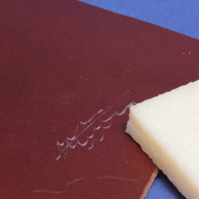 Natural rubber adhesive eraser removing dried glue from leather