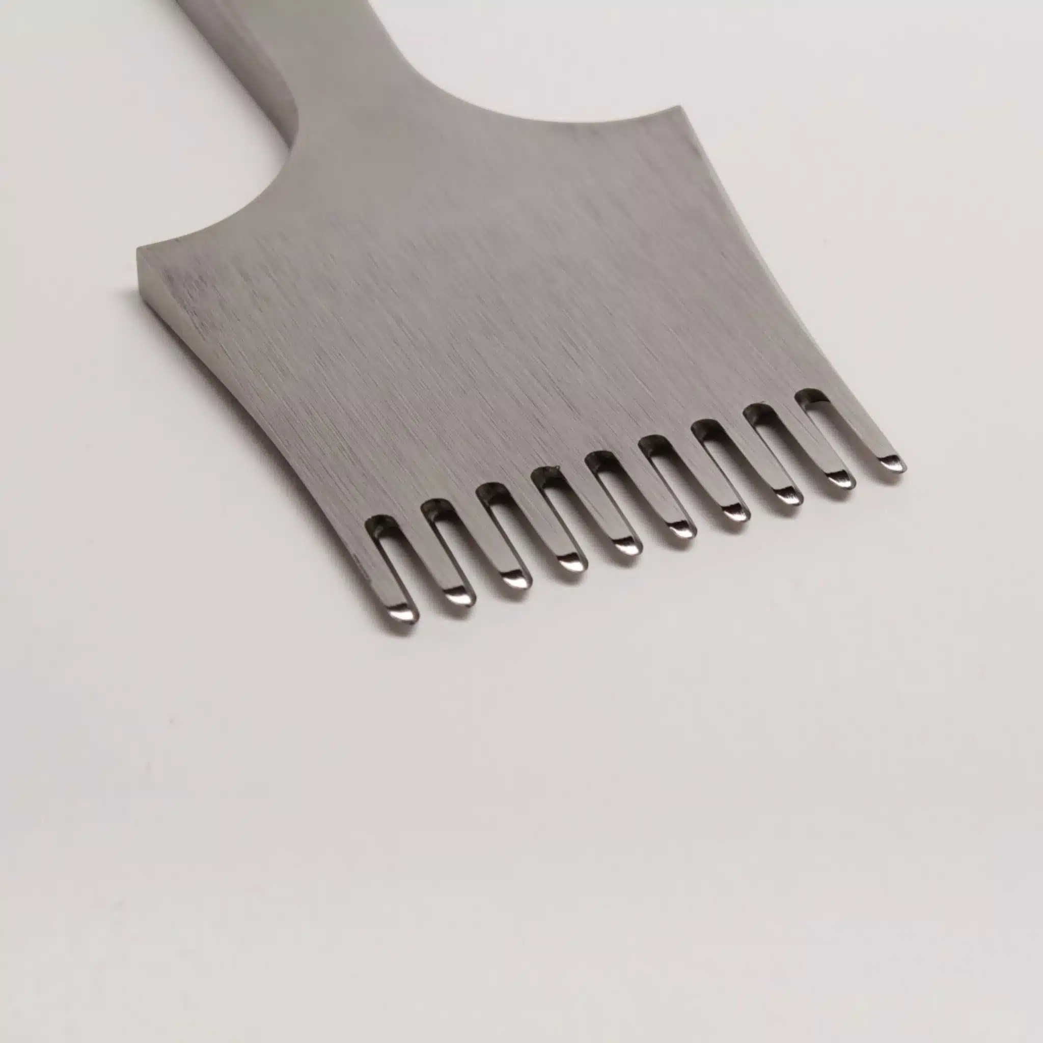Close-up view of a Kevin Lee 4mm diamond iron