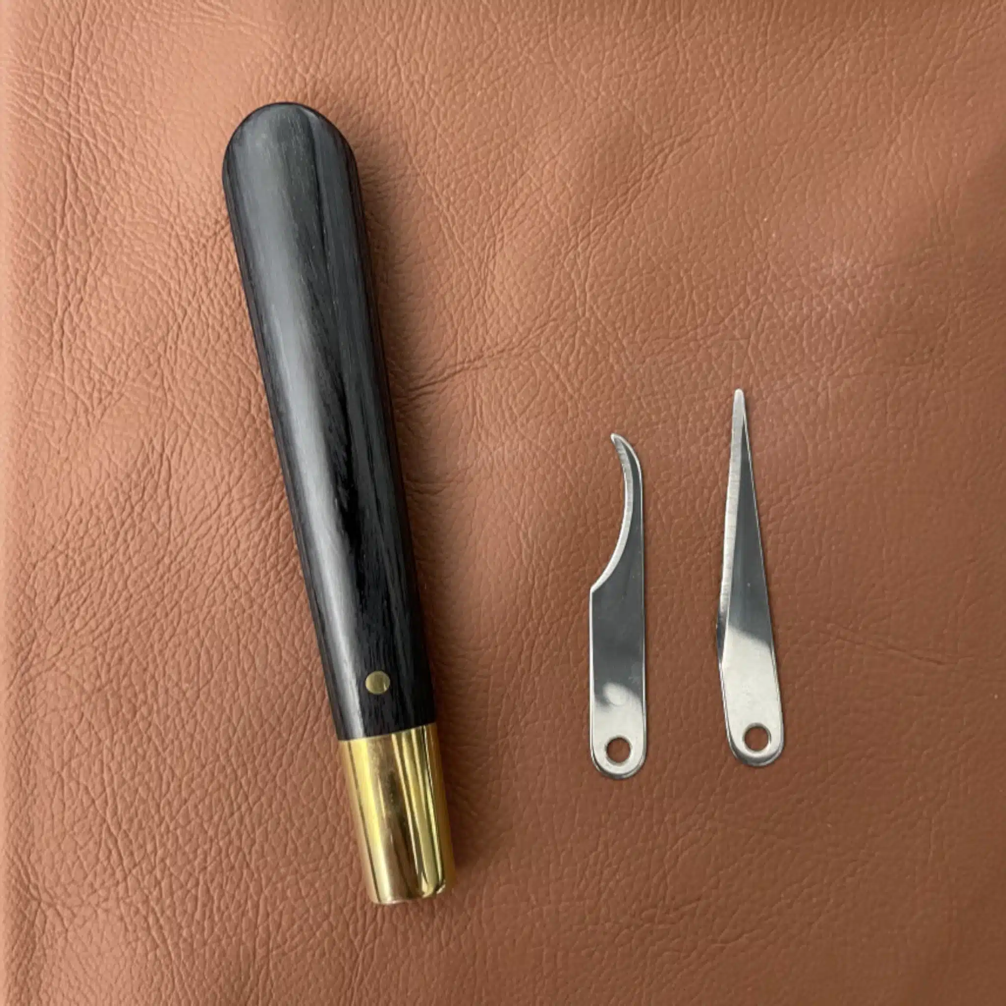 Kevin Lee pattern knife handle separated from its straight and curved blades